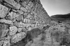 Spoil heap retaining wall